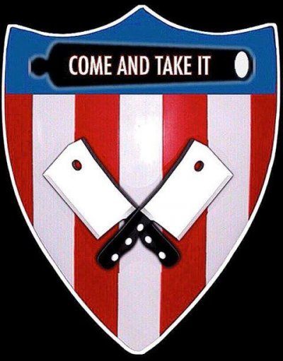Shield shaped logo with a blue top and red and white striped bottom to evoke the US flag. A black image of a cannon is imposed over the blue and reads "come and take it." Over the stripes are two crossed butcher's cleavers.